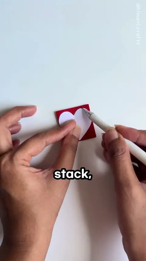 Someone cuts a paper man with folded arms, wait till the card opens?